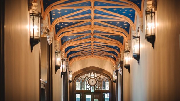 A hallway with a vaulted ceiling featuring a star pattern and ornate wooden beams. - Portrona (Isle of Lewis)