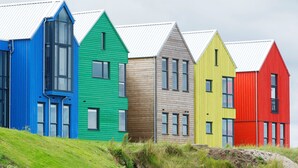 A row of colorful houses with pitched roofs and windows. - Northstar 2 (Wick)
