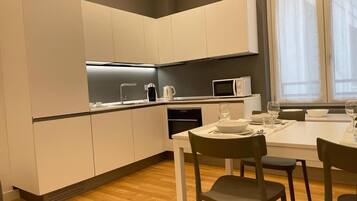 Family Apartment | Private kitchen | Full-size fridge, microwave, oven, stovetop