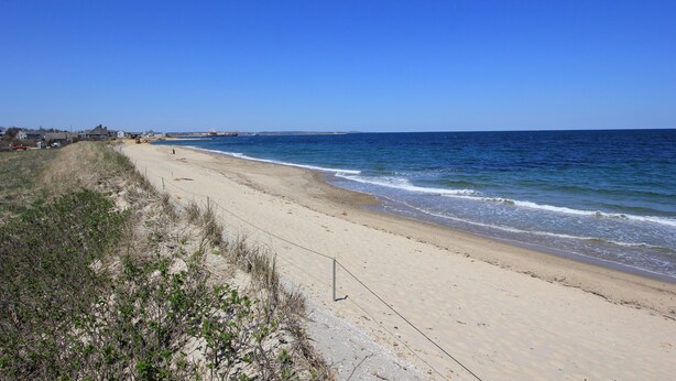 A sandy beach with a clear blue sky and ocean. - 2 John Ewer Rd (Sandwich)