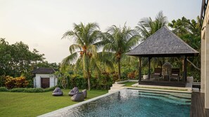 A pool area with a gazebo, seating, and a small structure. - Spectacular Ocean View Sunset Villa Uluwatu (Bali)