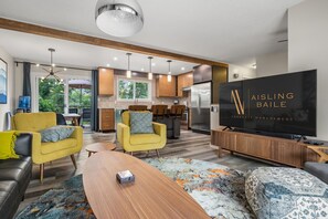 Smart TV, fireplace, books, stereo
