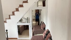 A hallway with a staircase leading to a bedroom. - Vacation Home Paola Aurigo, relaxation, quiet and 16 km from the sea (Aurigo)