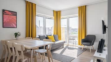 Standard Apartment, 3 Bedrooms | Living area | Flat-screen TV