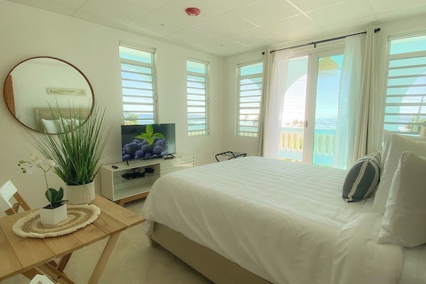 Panorama kamer, 1 queensize bed, uitzicht op oceaan | Uitzicht op strand/zee