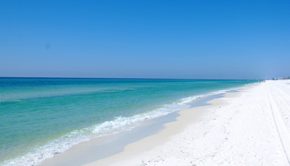 On the beach, sun loungers, beach towels