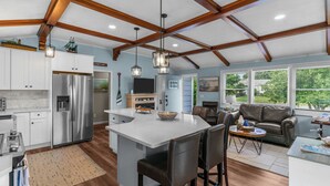 A spacious kitchen with a large island, stainless steel appliances, and a wooden ceiling. - Reserve Fall 2026! Beach House in the Pier W/ POOL, short walk to the beach! (Narragansett)