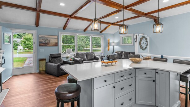 A spacious kitchen with a large island, wooden beams on the ceiling, and pendant lighting. - Reserve Fall 2026! Beach House in the Pier W/ POOL, short walk to the beach! (Narragansett)