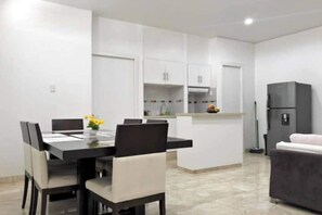 Enjoy a modern kitchen and dining space with an island and casual seating area.