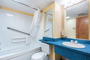 A bathroom with a bathtub, toilet, and sink. - Ocean Sands Resort Oceanfront condo with Oceanfront Balcony (Virginia Beach)