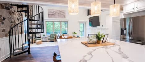 Enjoy cooking in this well-equipped kitchen with a large island and stainless steel appliances.