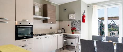 Fridge, oven, cookware/dishes/utensils