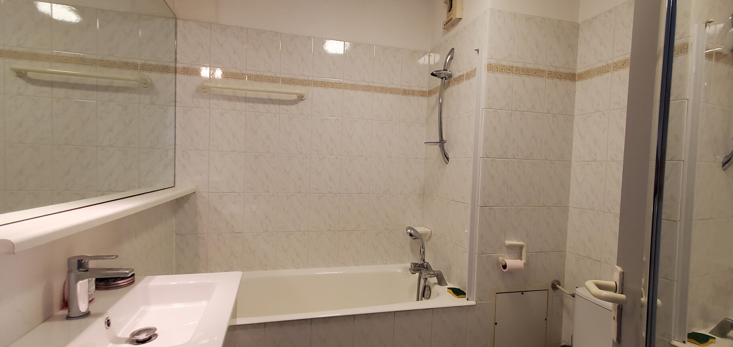 A bathroom with a bathtub, a shower, and a toilet.