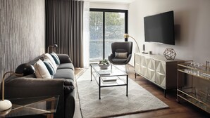 A modern living room with a sofa, a coffee table, a TV, and a cabinet. - ▶Cool Apt in Condesa 3BD, 3BA (Ciudad de México)