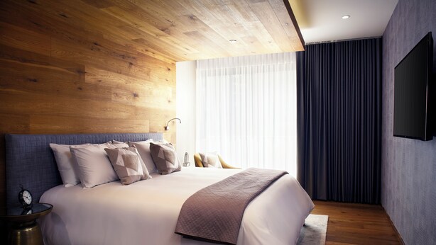 A modern bedroom with a wooden ceiling, a large bed with multiple pillows, a bedside table with a clock, and a large window with curtains. - ▶Cool Apt in Condesa 3BD, 3BA (Ciudad de México)