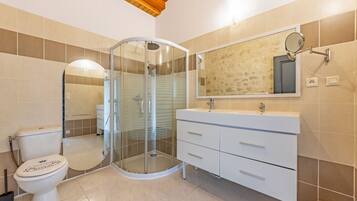 Shower, hair dryer, towels, soap