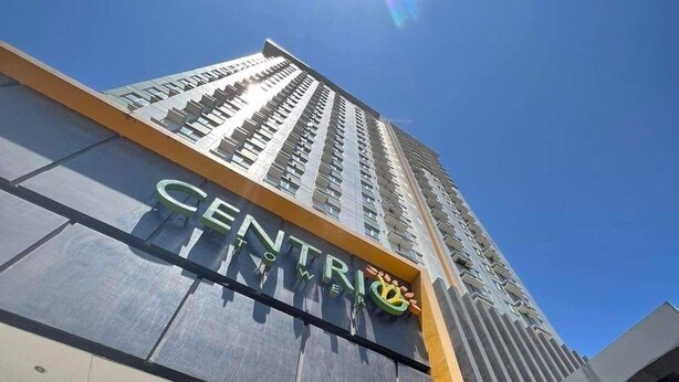 A tall building with a sign that reads "CENTRION". - Centrio Tower 926 (Cagayan de Oro)