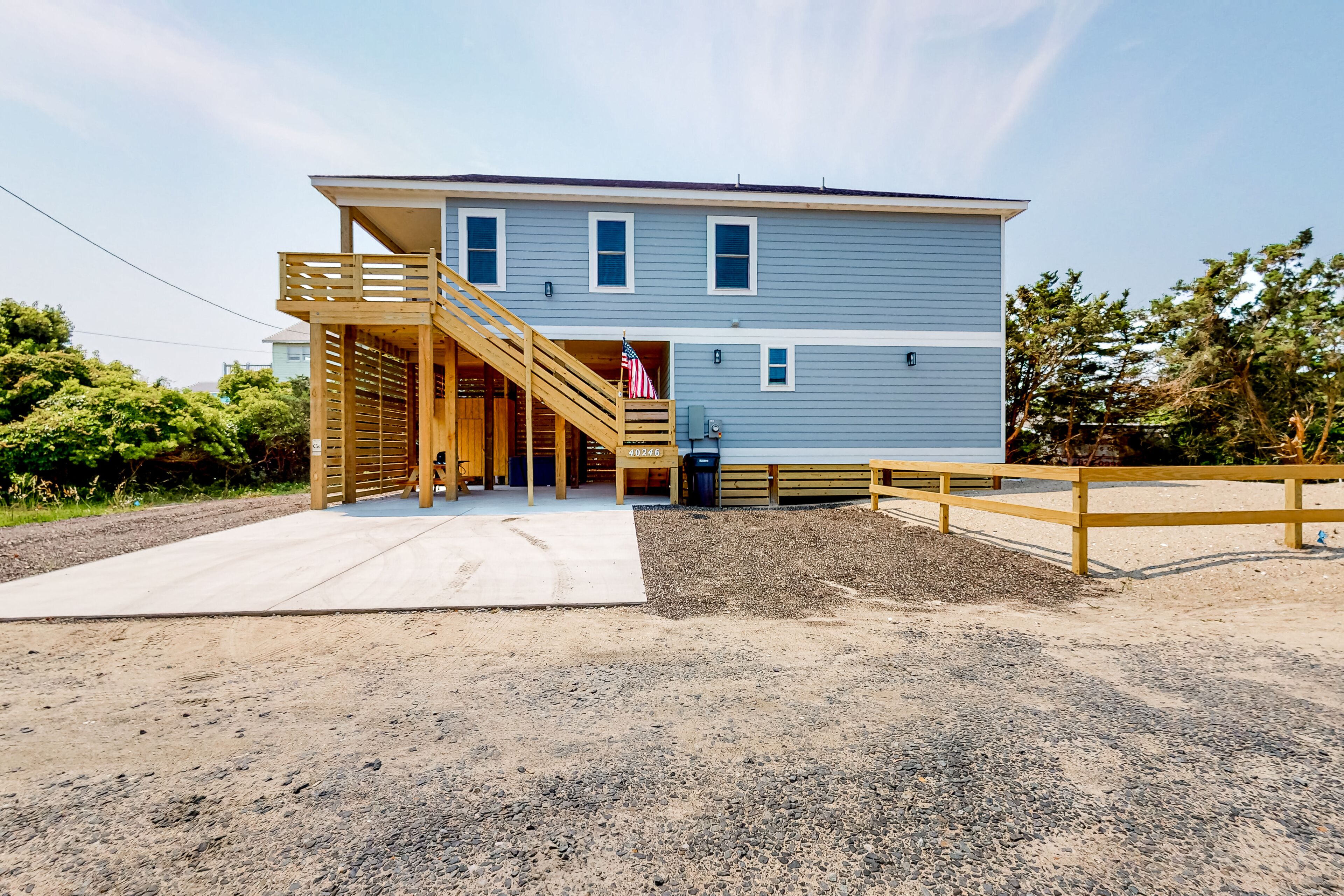 Charming dog-friendly home with hot tub, grill, patio, shared pool, & W/D