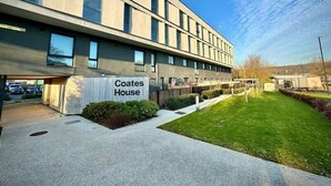 A modern building with a sign reading "Coates House". - Coates House one bed - Nailsea (Bristol)