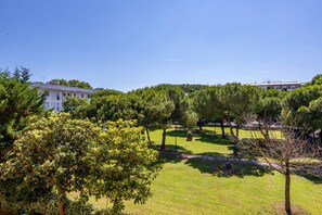 A grassy area with trees and a building in the background. - GuestHost - Cozy and roomy apartment 93 sqm located on the first floor of a building WITHOUT a lift (stairs to access) can accommodate up to 6 people. The property, equipped with all the main comforts: bars, restaurants, supermarkets and pharmacy.The acc (Viareggio)
