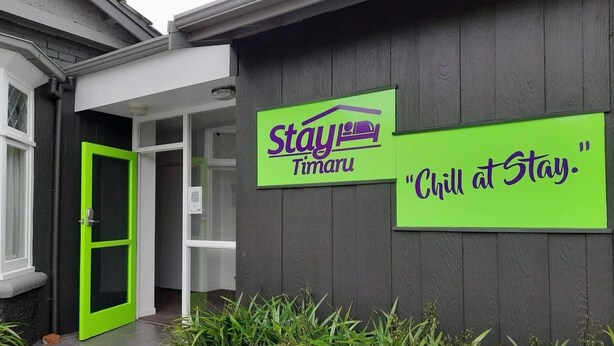 A building with a green door and two signs: "Stay Timaru" and "Chill at Stay." - Stay Timaru (Timaru)