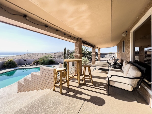 Relax by the pool surrounded by desert views and a mountainous backdrop.