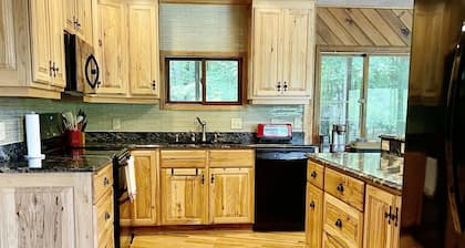 Chalet on Manistee River with amazing backyard pond. 5 minutes from Fife Lake.