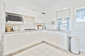 Fridge, microwave, stovetop, coffee/tea maker