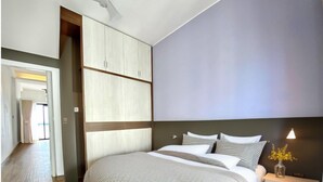 ดีไซน์อพาร์ทเมนท์ | เครื่องนอนระดับพรีเมียม, โต๊ะทำงาน, Wi-Fi ฟรี, ผ้าปูที่นอน