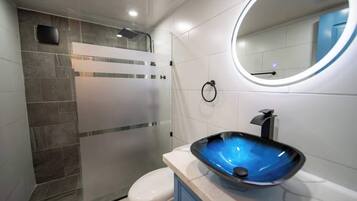 Shower, towels, soap, toilet paper