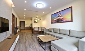 Deluxe Apartment | Living area | 43-inch Smart TV with digital channels, TV - Paradise Home Tay Ho (Hanoi)
