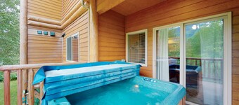 Mountain-view condo with private hot tub, fireplace, deck, W/D