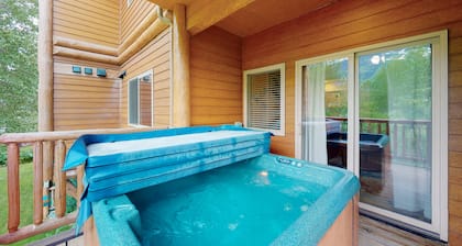 Mountain-view condo with private hot tub, fireplace, deck, W/D