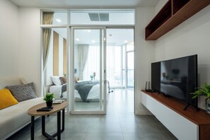 Basic Apartment, 2 Bedrooms, Balcony, City View | Living area | 42-inch Smart TV with digital channels, TV - Penthouse Residence by Caerus Management (Phnom Penh)