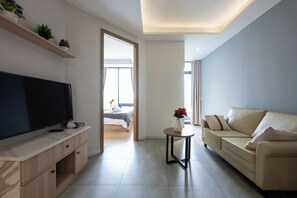 Basic Apartment, 2 Bedrooms, Balcony, City View | Living area | 42-inch Smart TV with digital channels, TV - Penthouse Residence by Caerus Management (Phnom Penh)