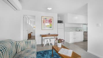 Standard Apartment | Living area | 50-inch Smart TV with digital channels, TV