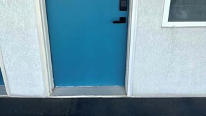 A blue door with a black handle, a mailbox with the number 13, and a window with a view of trees. - Stand Rock Studios in Wisconsin Dells! (Wisconsin Dells)
