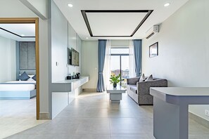 Junior Suite, Balcony | Living area | 46-inch Smart TV with satellite channels, TV - THE SQUARE KAMPOT HOTEL (Kampot)