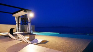 An outdoor swimming pool area with lounge chairs and a covered seating area at night. - 1 Villa with private beach, boat jet, etc. can be directly unloaded Vacation Rental (大津市)