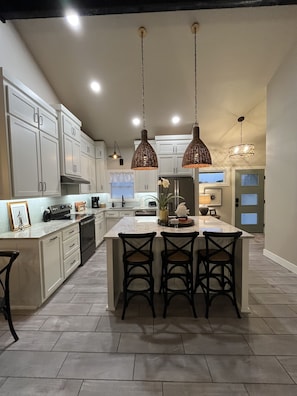 Enjoy cooking in this well-equipped kitchen with a central island and oven.