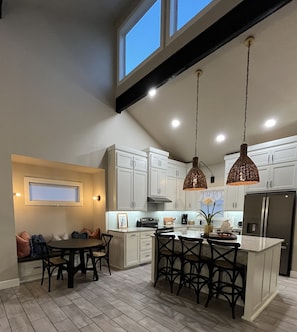 Enjoy cooking in this well-equipped kitchen with a central island, ample counter space, and integrated appliances.