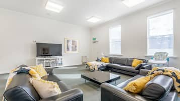 Standard House | Living area | 70-inch TV with digital channels