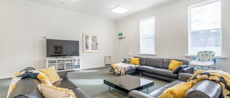 Standard House | Living area | 70-inch TV with digital channels