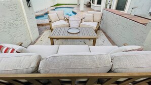 A patio area with a pool, outdoor furniture, and a covered seating area. - Private and Charming Vacation Home near Downton Gilbert - Pool/hot tub/fireplace (Gilbert)
