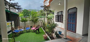 Deluxe Triple Room, 2 Bedrooms, Garden View | Garden view - Classic Inn by Meera Hotels (Narendranagar)