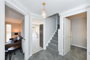 Staircase and seating area lead to a cozy space.