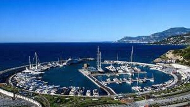 A marina with boats docked, surrounded by water and greenery. - Villa Isabella: relaxation, calm, pool and beautiful beaches nearby (Ventimiglia)