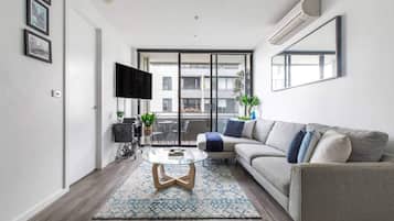 Basic Apartment, Multiple Beds | Living area | TV