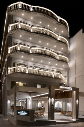 A multi-story hotel with a grand entrance, a visible restaurant named 'The Brunch Bar,' and a sign for 'EPAVLI GRACE HOTEL SUITES.' - Epavli Grace Hotel (Chania)