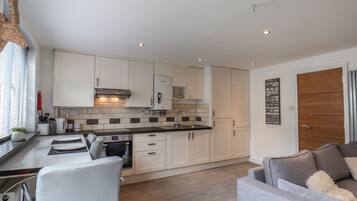 Fridge, electric kettle, toaster, cookware/dishes/utensils